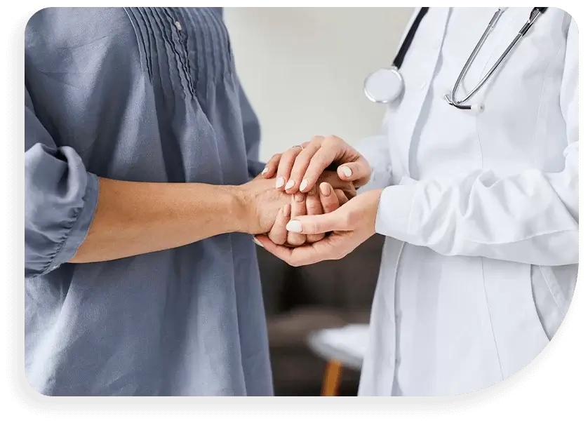 doctor and patient with hands clasped at Health and Vitality Center in Los Angeles